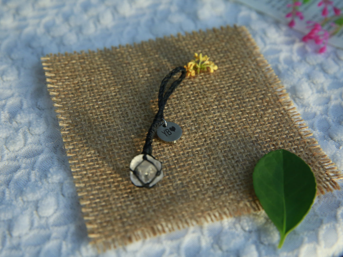 Black waxed cord Clear Quartz pet pendant with one natural stone and a personalized 12mm round tag on burlap