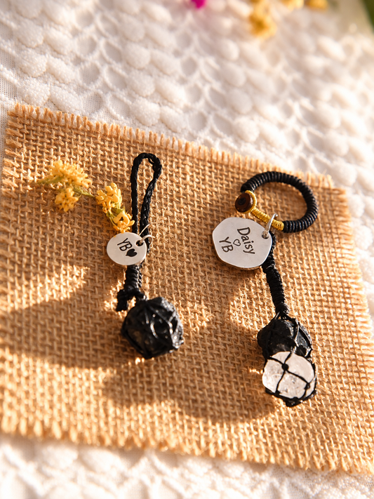 Matching pet and owner set with a black obsidian pet pendant and an obsidian and Clear Quartz bag charm, both in black cord with personalized round tags